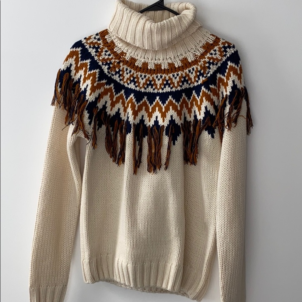 multi tasseled turtleneck